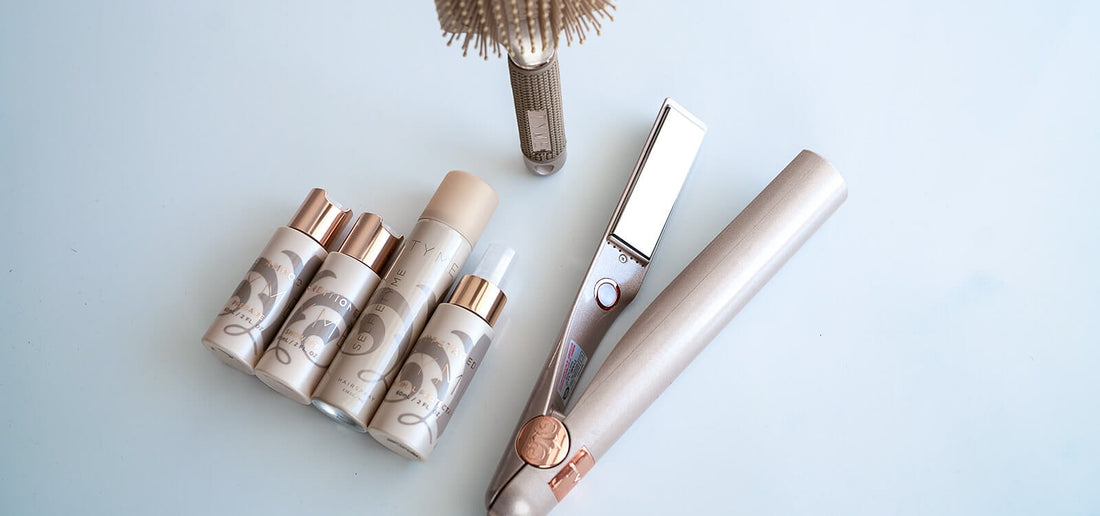 TYME haircare products displayed along side the TYME Iron and Paddle brush