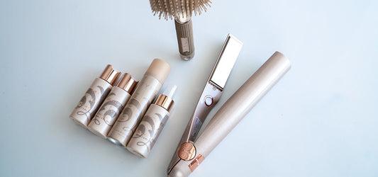 TYME haircare products displayed along side the TYME Iron and Paddle brush