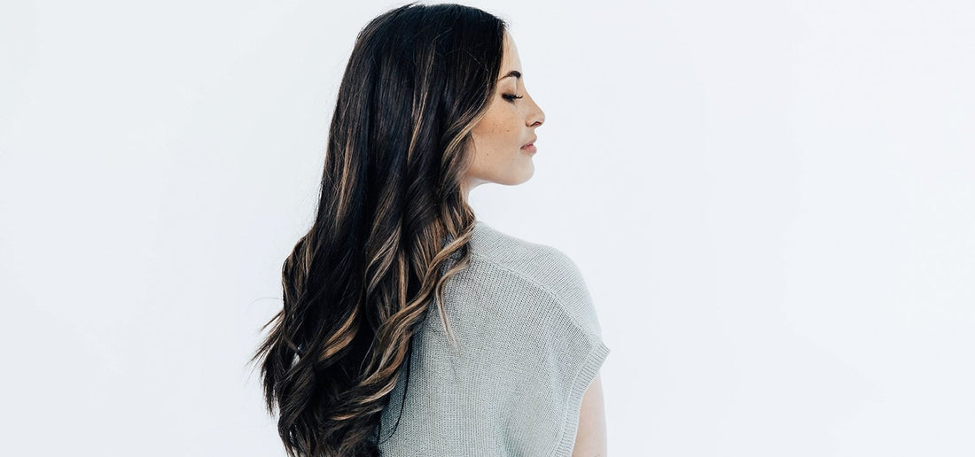 Woman with black hair/highlights and TYME curls