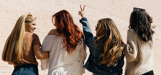Lifetyme photo of 4 women-back of hair-1 girl piece sign
