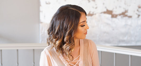 Woman with short brown hair and TYME curls 