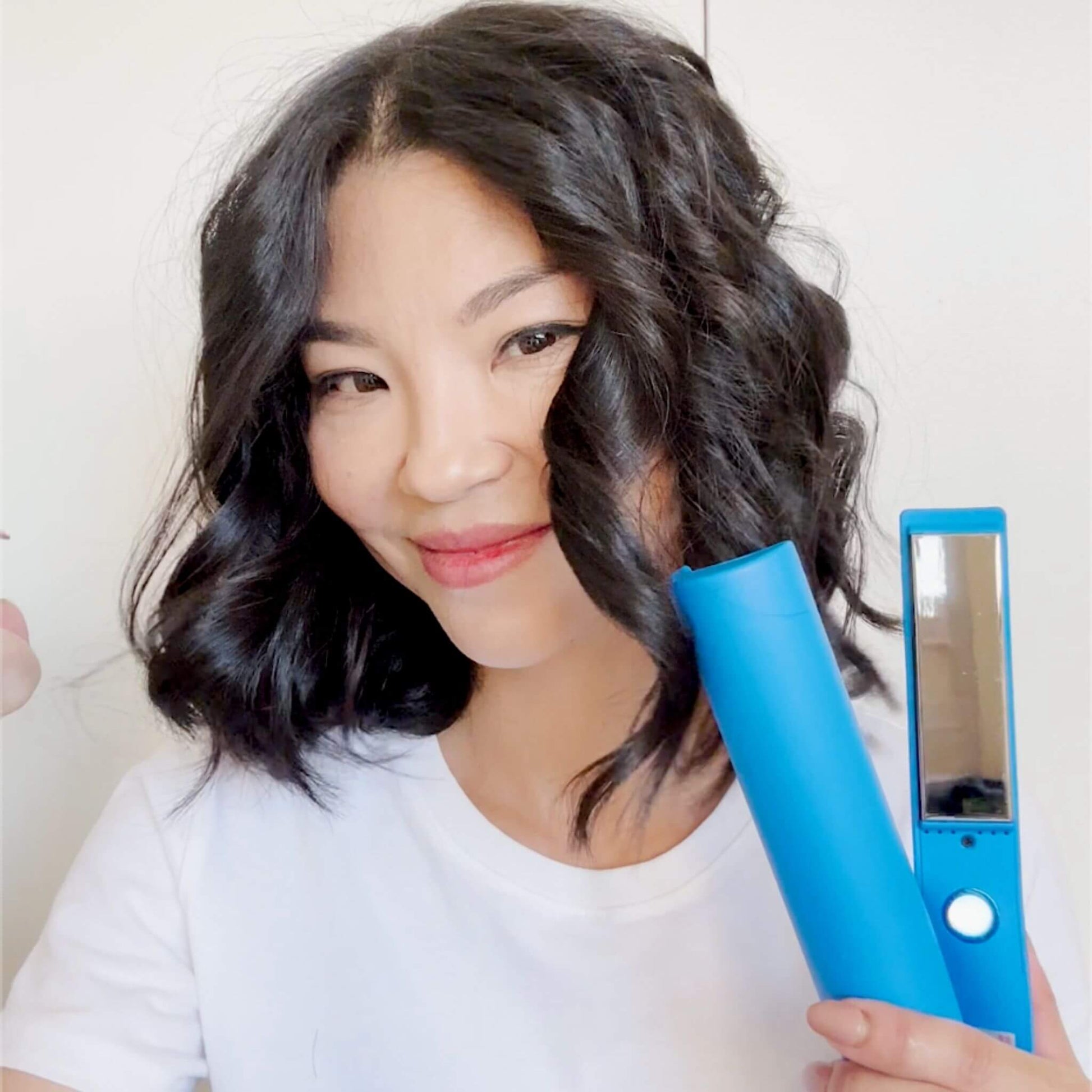 Asian woman using the TYME Iron Pro: Galaxy.