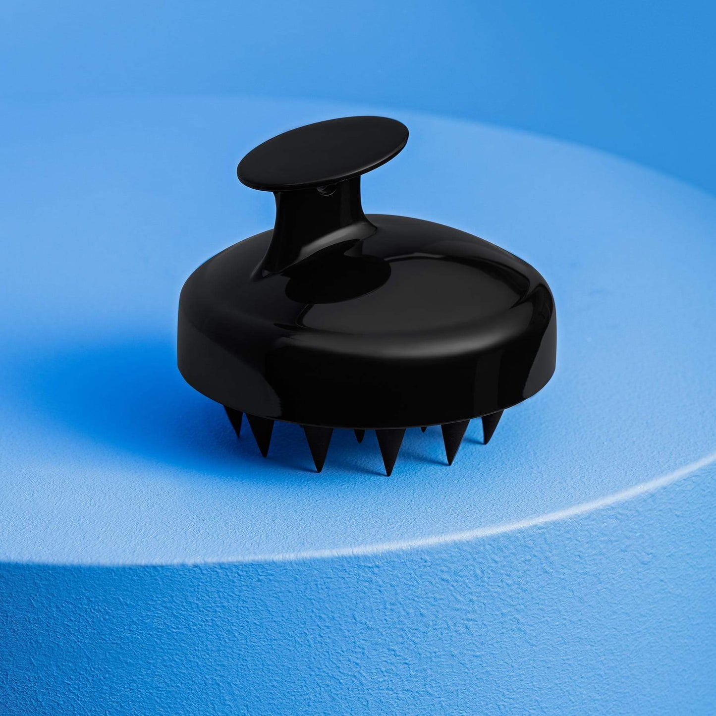 Shampoo hair brush fits comfortably in your palm.