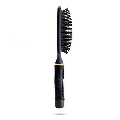 Side view of TYME's limited edition Obsidian paddle brush.