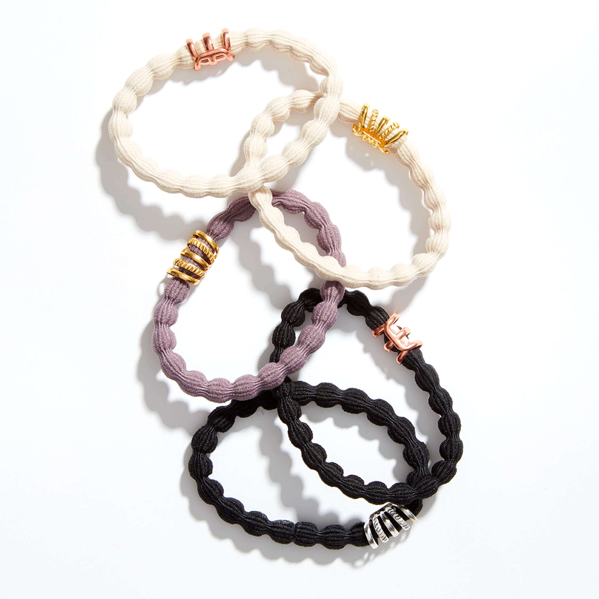 five damage tug free ponytail holder and bracelet with rose gold and gold accent beads 