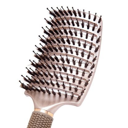 Zoomed in view of boar and nylon bristles on the curved head of the TYME Vented Detangler Brush.